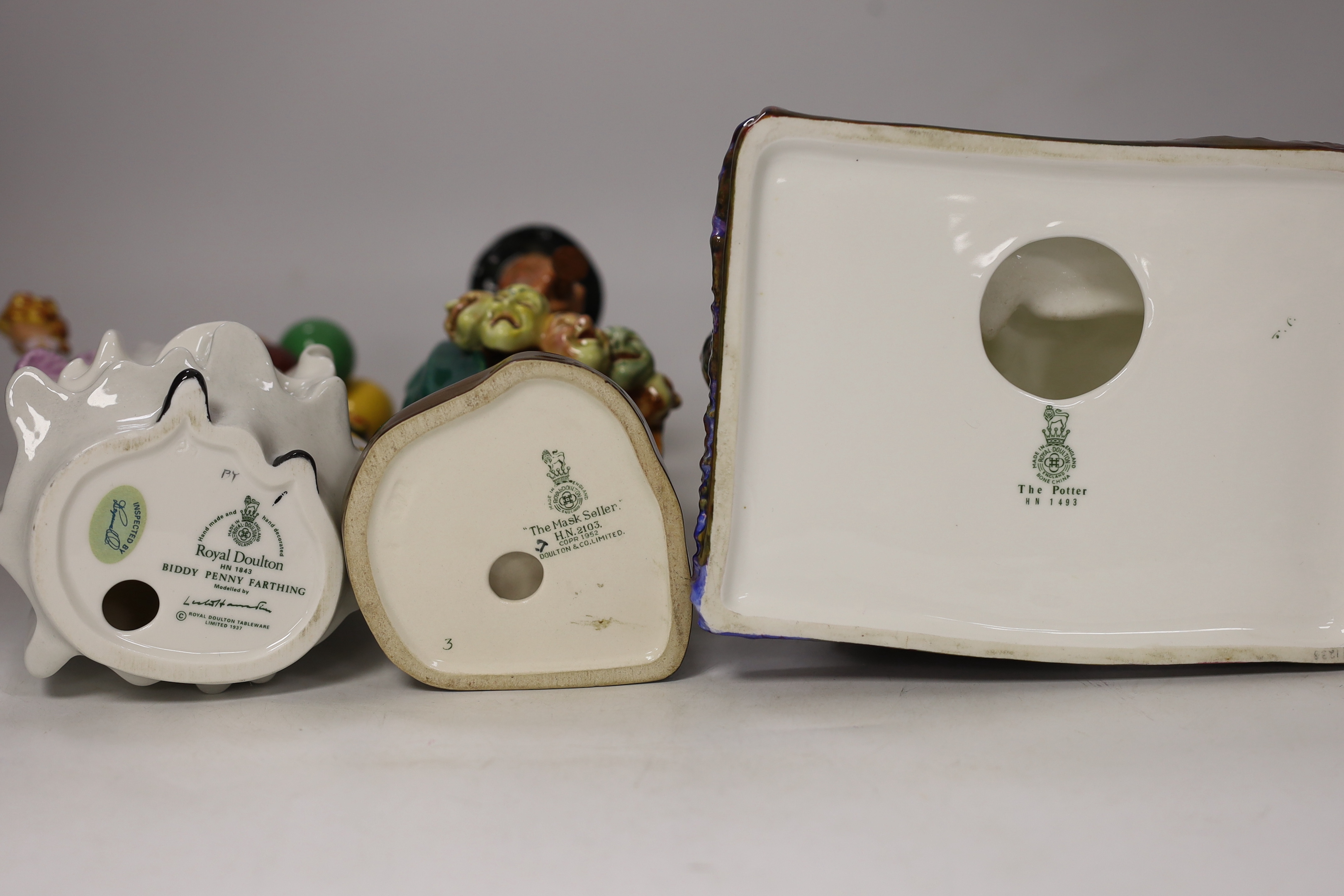 Five Royal Doulton figures, The Potter HN 1493, The Mask Seller, HN 2103, Falstaff HN 2054, Silks and Ribbons HN 2017 and Biddy Penny Farthing HN1843